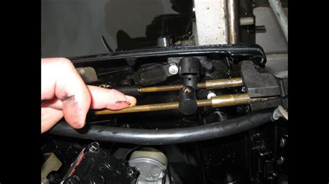 How do you adjust a Mercury outboard shift cable The shift cable end needs to be aligned with the center mark. . Force outboard throttle cable adjustment